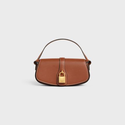 CLUTCH ON STRAP TABOU IN SMOOTH CALFSKIN TAN